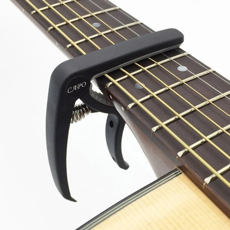 Capo gitar plastik 6 dawai ele - Musical Instrument Gif ulasan dan harga