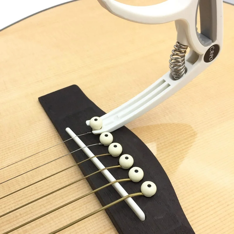 Capo gitar plastik 6 dawai ele - Musical Instrument Gif ulasan dan harga